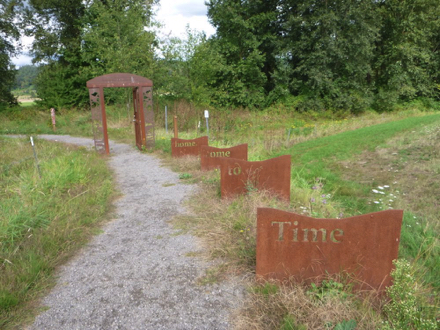 Door to the wetland area that is closed in the off-season – art work that says ‘Time to come home’